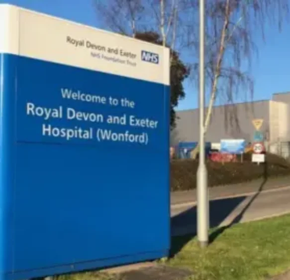 Woman hit by car at Devon hospital suffering head injury