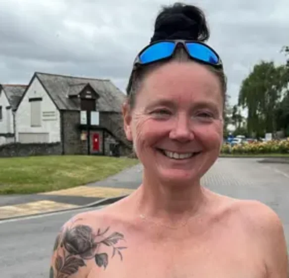 Topless runner takes part in topless swim in Devon