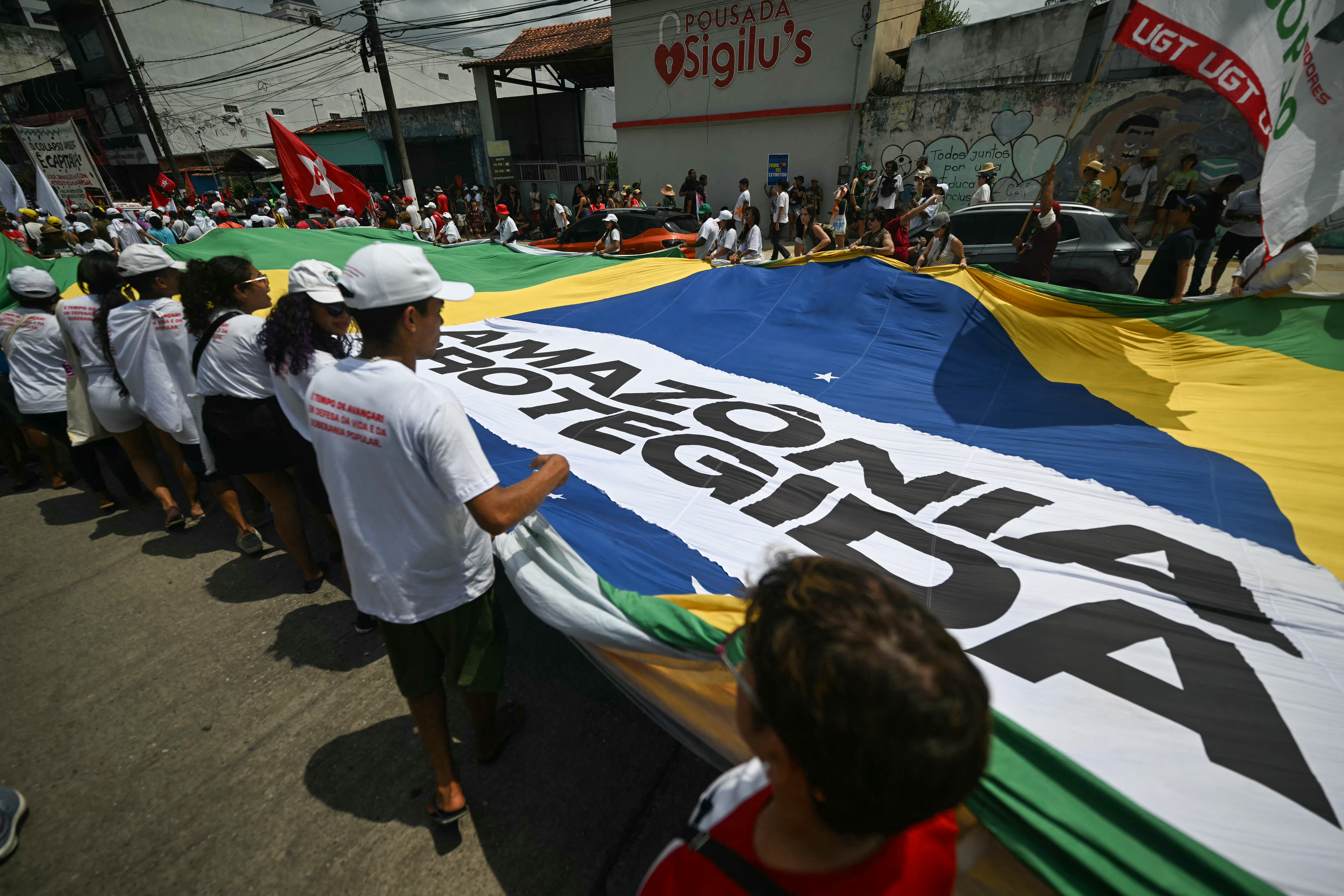 You are currently viewing Thousands march for climate action outside COP30 summit in Brazil | Climate Crisis News