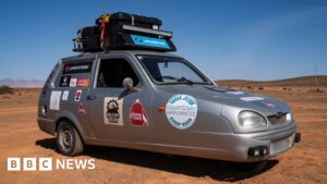 Read more about the article Pair in three-wheeled car reach Africa in world record attempt
