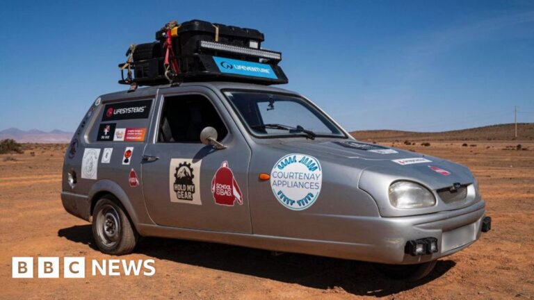 Read more about the article Pair in three-wheeled car reach Africa in world record attempt