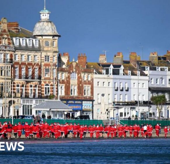 Santas limber up for festive Weymouth Beach charity pudding chase