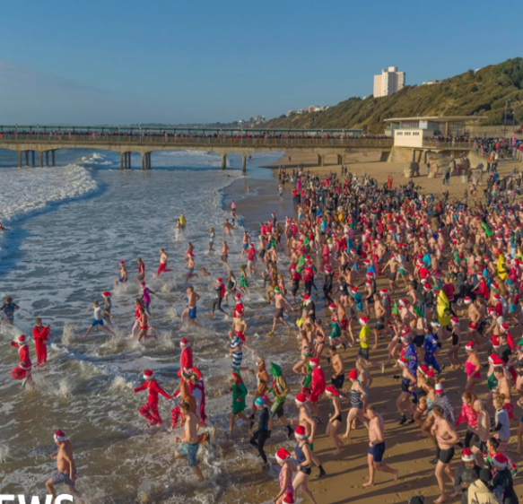 Hundreds brave the sea for charity Christmas dip at Boscombe Pier
