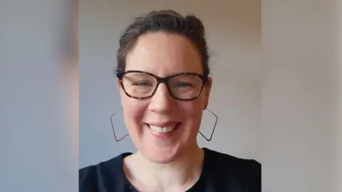 Supplied Lucy is looking at the camera and can be seen from the shoulders up. She